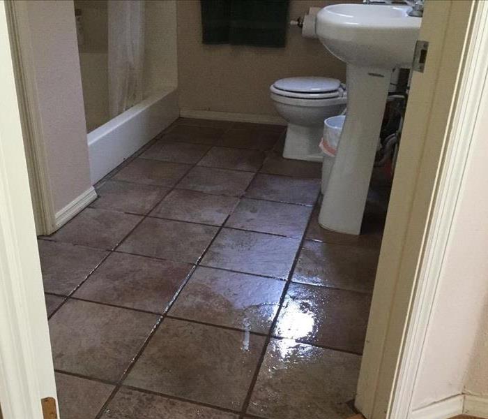Toilet Overflow Fills Bathroom Floor with Water
