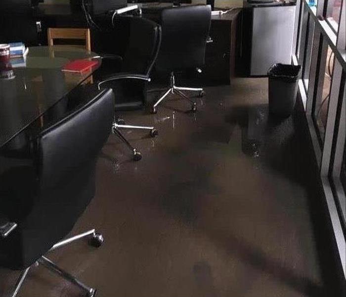 Flooded office meeting room with chairs 