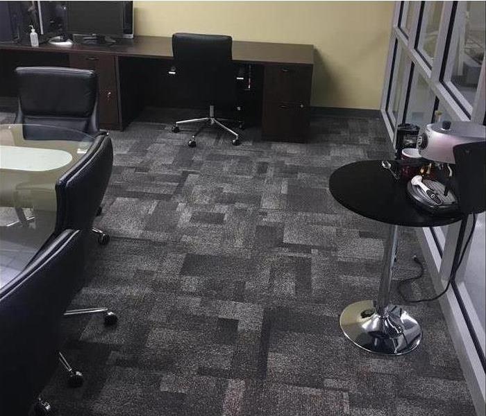 Dry office showing carpet and chairs 